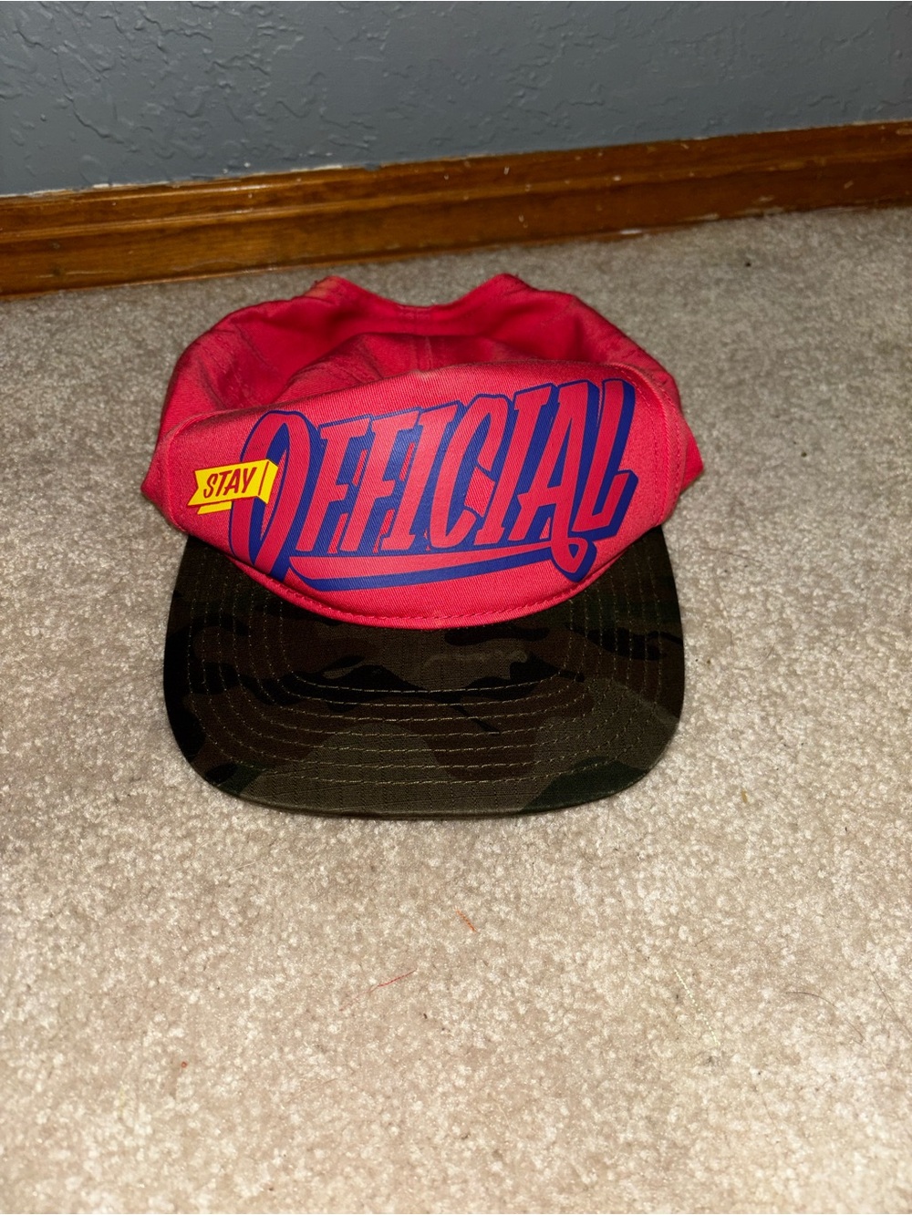 Stay Official Red Logo Snapback Hat with Camouflage Brim